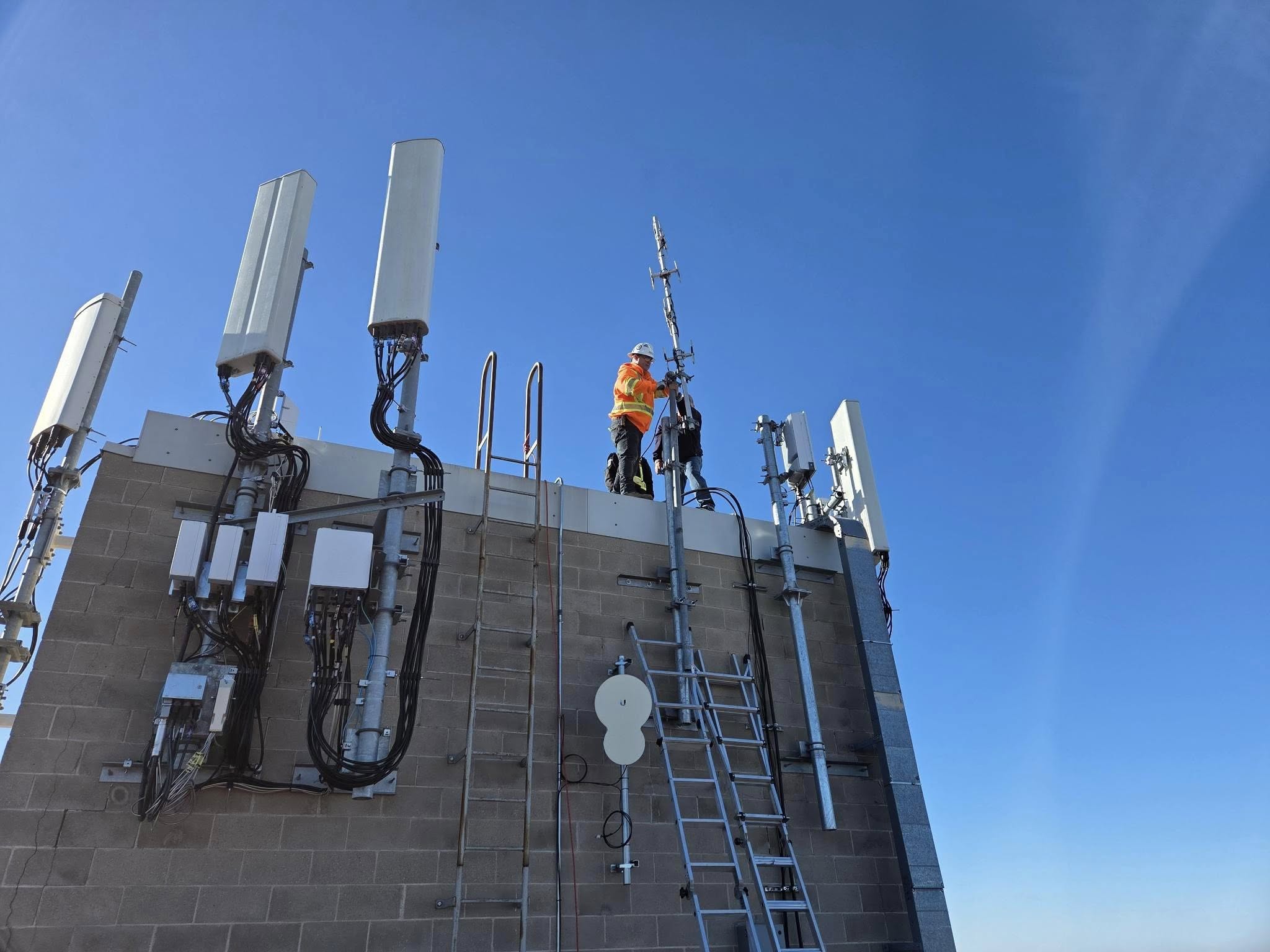 Crew mounting the 8-bay UHF antenna